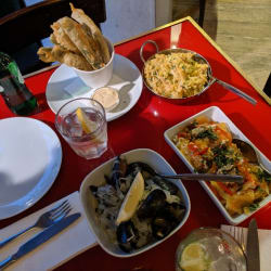 Green bean tempura, cod fish, stewed tomatoes, and mussels.